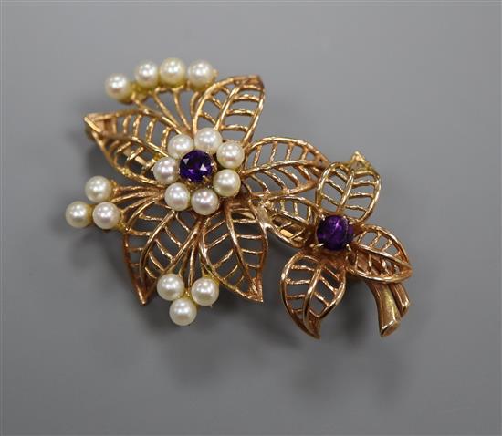 A 9ct gold, amethyst and cultured pearl set floral brooch, gross 7.9 grams.